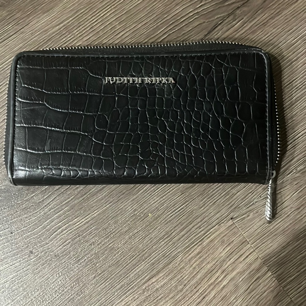 Judith Ripka wallet that zips around. Tons of space inside Wallet